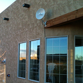 AlignTec technician installing wireless internet equipment
