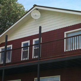 AlignTec wireless internet antenna being installed on a residential rooftop